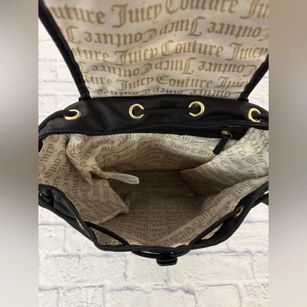 Juicy Couture black quilted backpack heart motif, drawstring top.